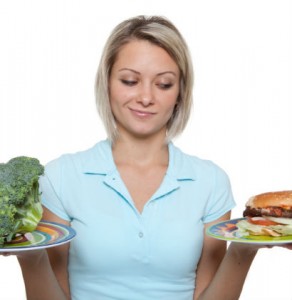 Female health coach going over good and bad food choices.