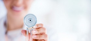 Woman holding stethoscope