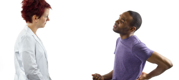 Recent DPT grad doing patient intake with male basketball player.