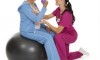 ACE AHFS-certified trainer working with her patient on a stability ball.