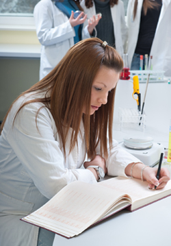 Nurse studying pathology